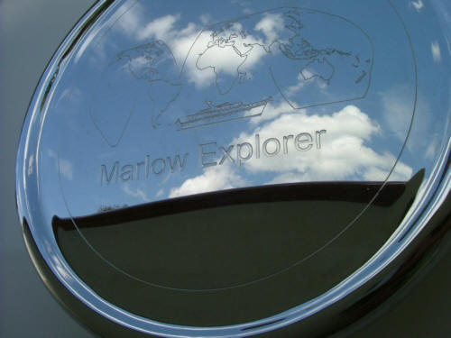 Highly polished door handle with ME Logo
